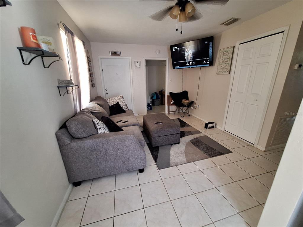 8564 Agress Avenue North Port, FL 34287 - Photo 4 of 18 a living room with furniture and a flat screen tv