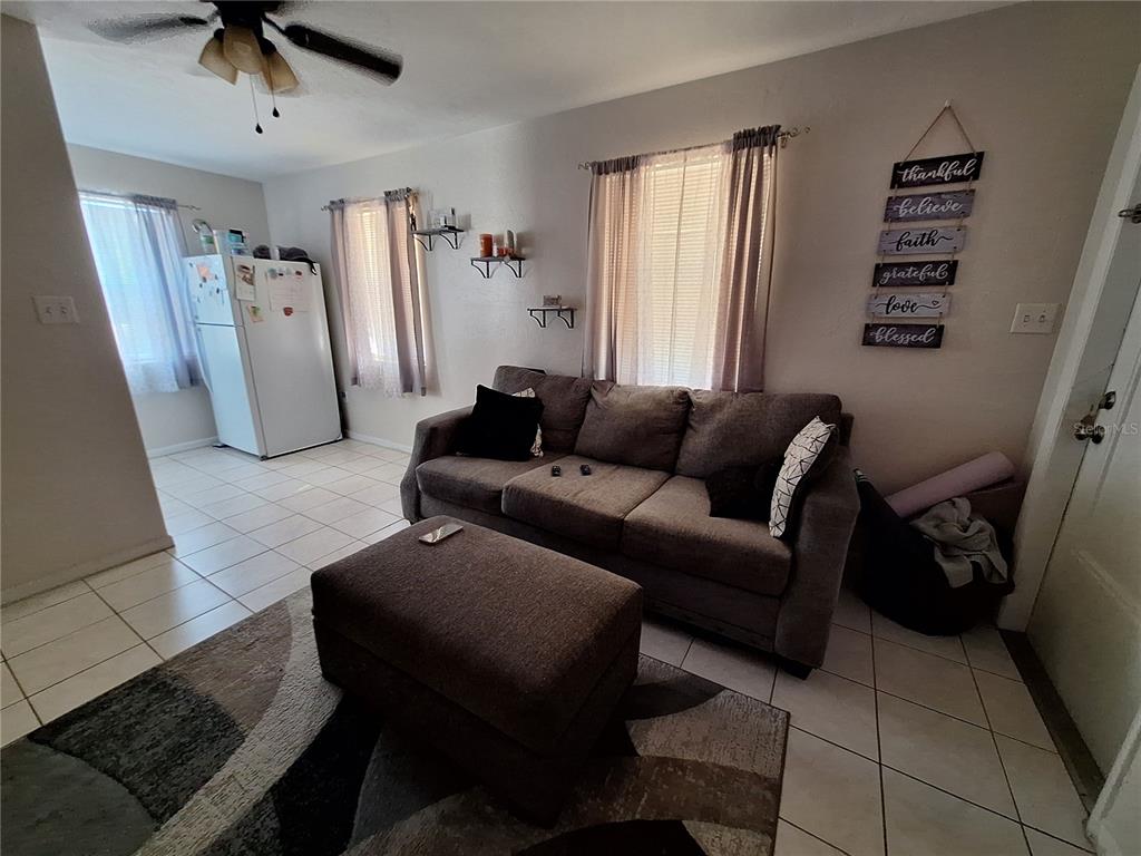 8564 Agress Avenue North Port, FL 34287 - Photo 5 of 18 a living room with furniture and a window