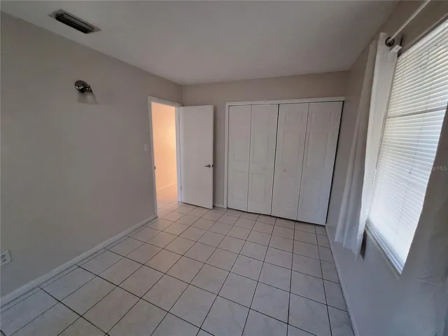 a view of an empty room and entryway