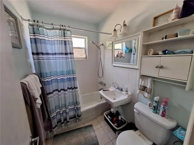 a reading room with furniture window and wooden floor