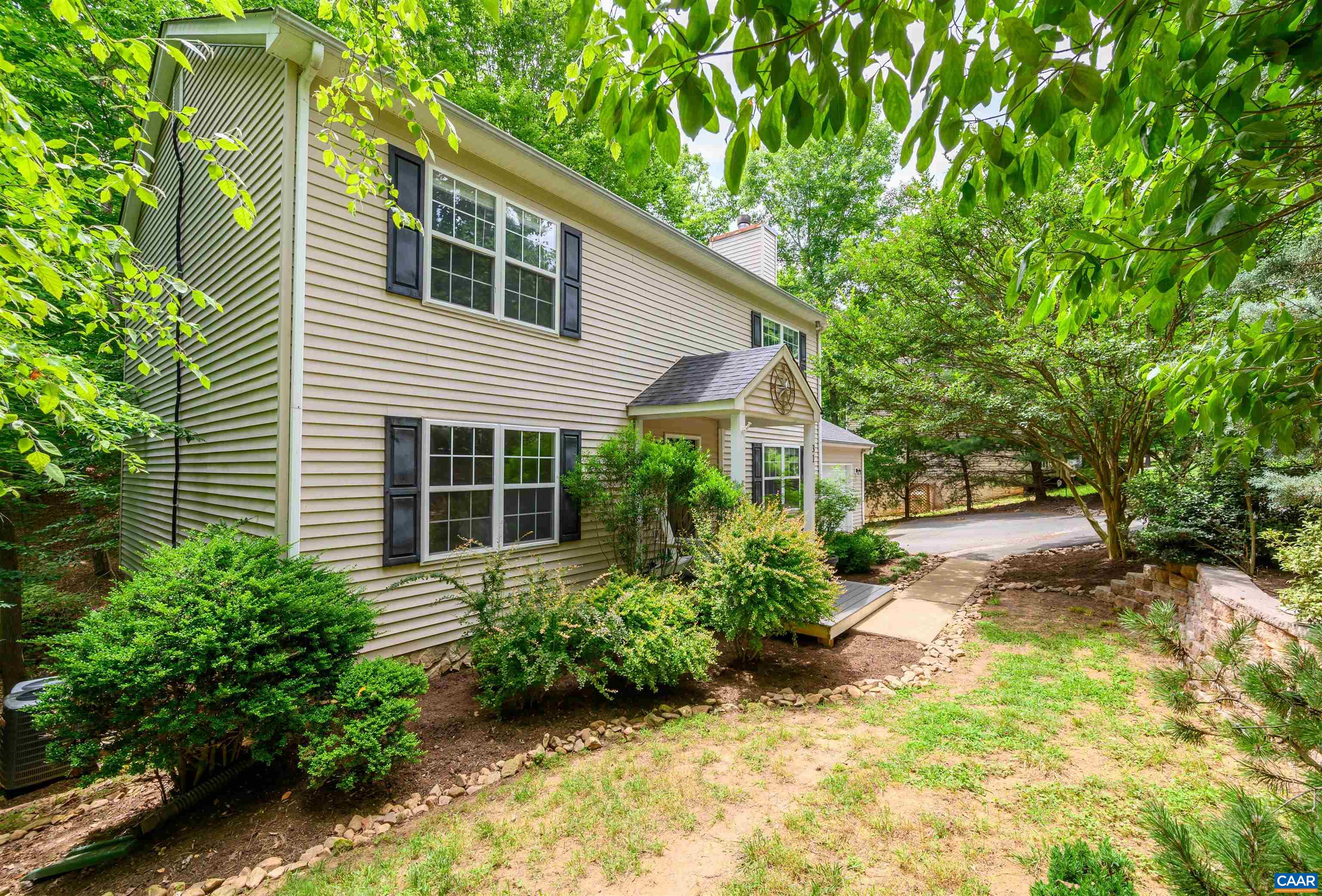 31 Zephyr Road Palmyra, VA 22963 - Photo 35 of 44 a view of a house with a yard and plants
