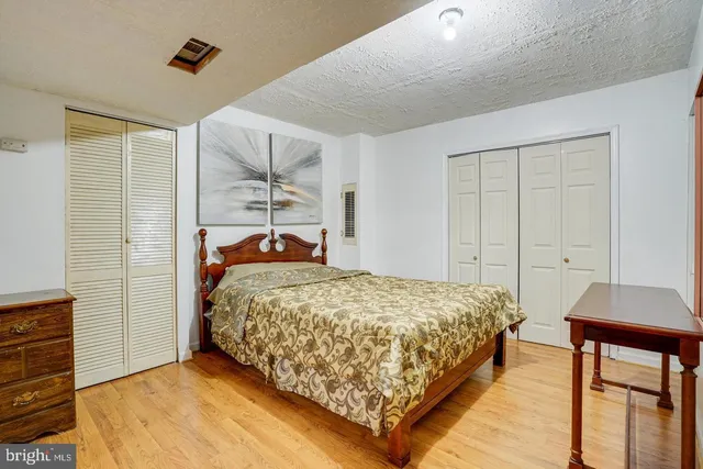 a bedroom with a bed and a table in it