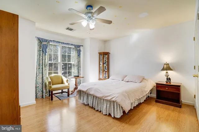 a bedroom with a bed and a couch