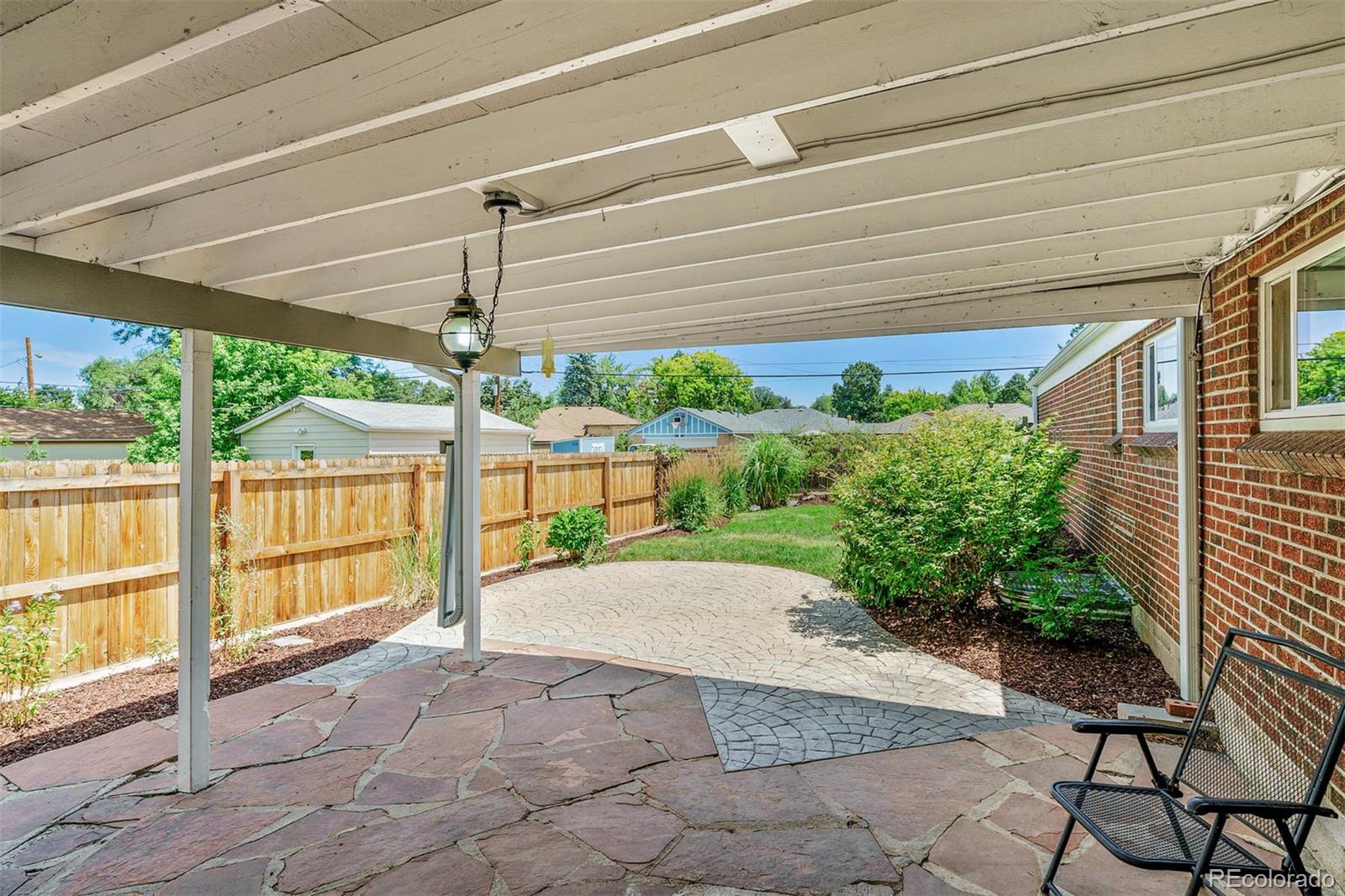 3270 Ames Street Wheat Ridge, CO 80212 - Photo 29 of 34 a house view with a backyard space
