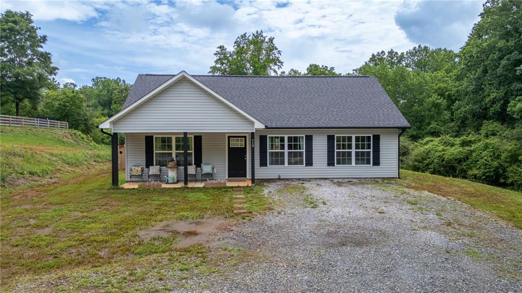118 Wash Rider Road Dahlonega, GA 30533 - Photo 3 of 37 a front view of a house with garden