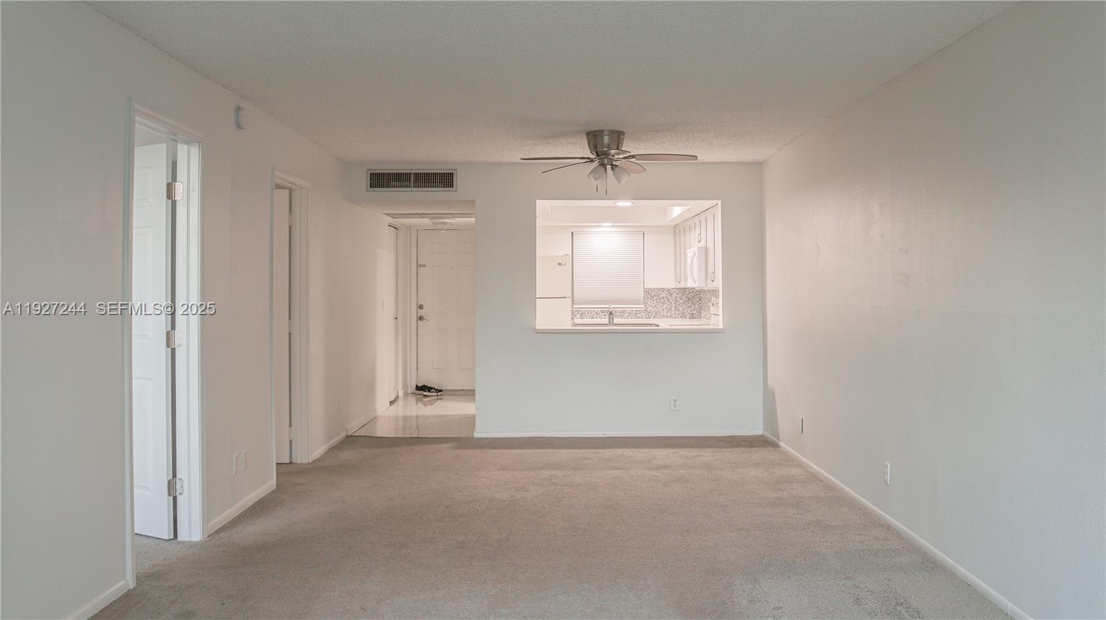 9421 Evergreen Place, Unit 103 Davie, FL 33324 - Photo 1 of 32 an empty room with windows and closet