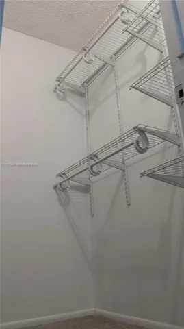 a view of a room with racks on the wall