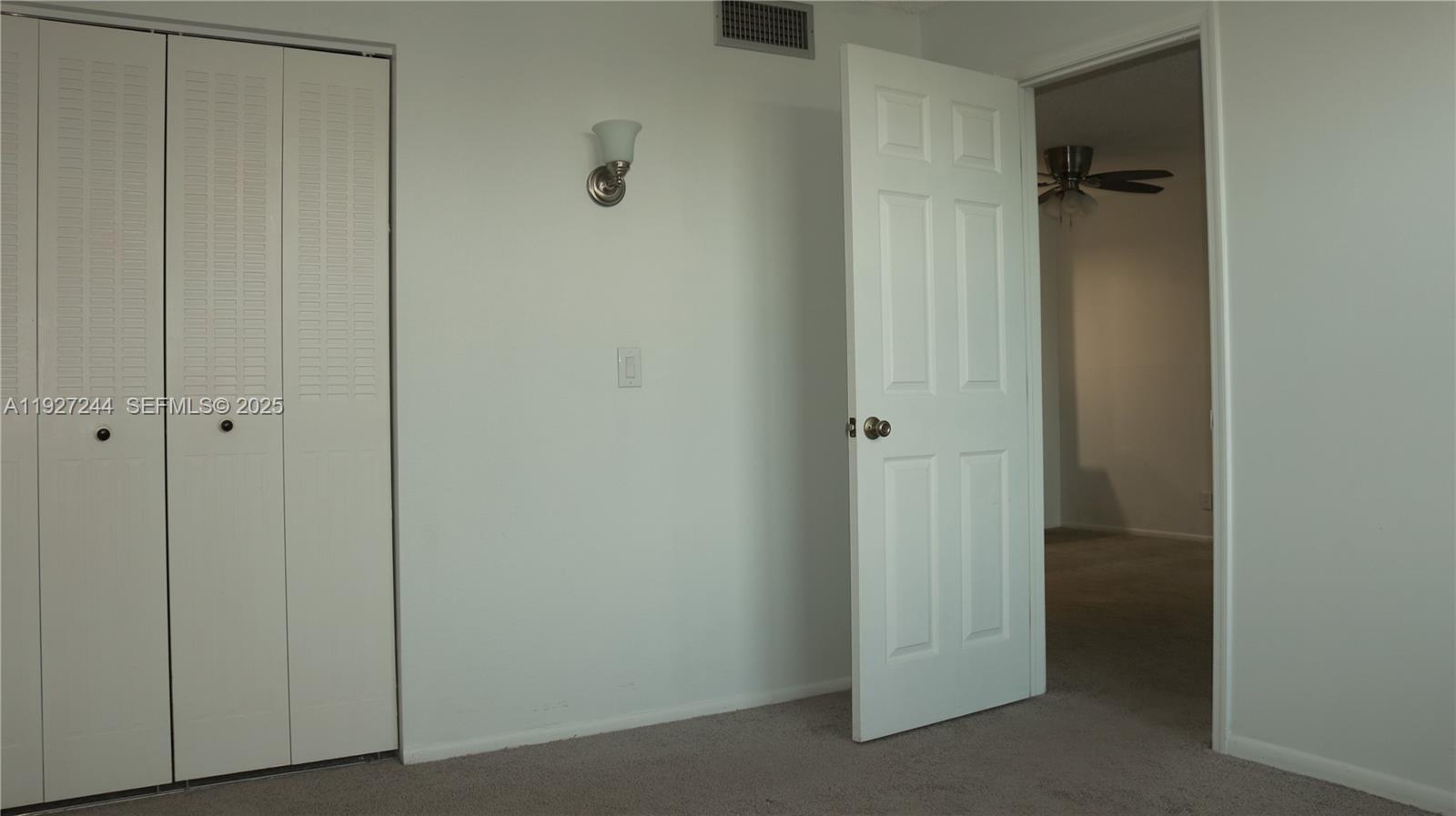 9421 Evergreen Place, Unit 103 Davie, FL 33324 - Photo 23 of 32 a view of a wardrobe
