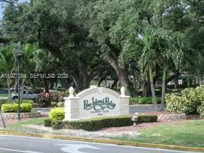 a view of a park with large trees