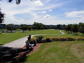 9421 Evergreen Place, Unit 103 Davie, FL 33324 - Photo 28 of 32 a view of a park with large trees