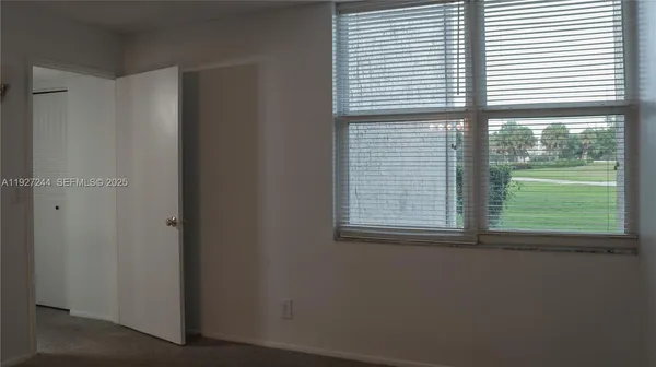 a view of a room that has a window in it