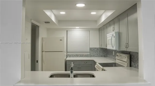 a bathroom with a sink and a large mirror