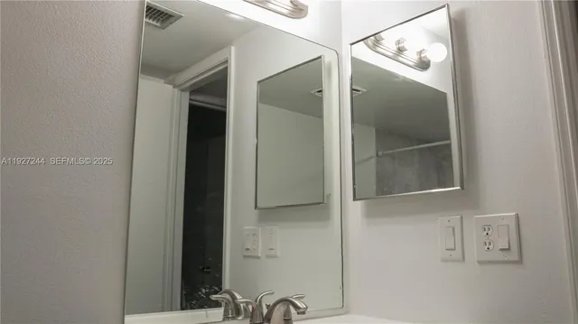 a bathroom with a mirror
