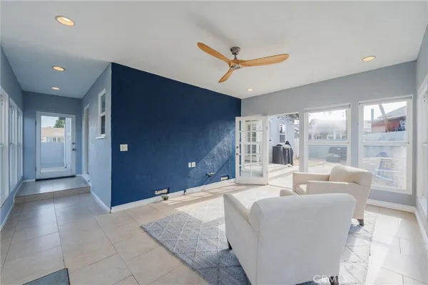 a living room with furniture and a large window