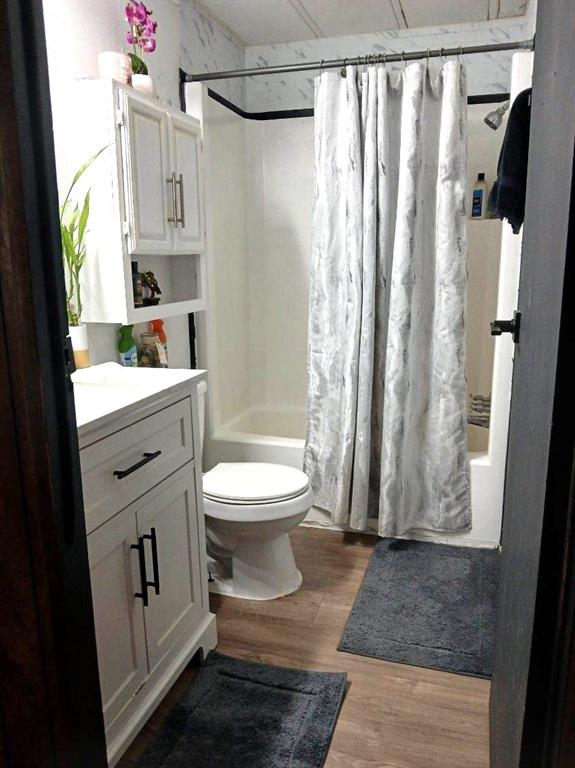 9153 Bouncer Road Quinlan, TX 75474 - Photo 16 of 27 a bathroom with a toilet a sink and a shower