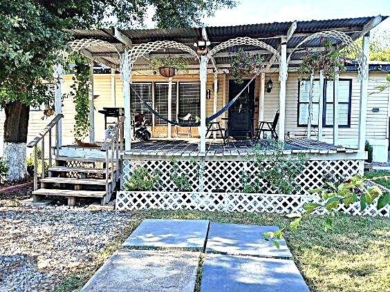 9153 Bouncer Road Quinlan, TX 75474 - Photo 2 of 27 a front view of a house with a glass door