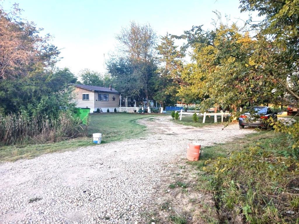 9153 Bouncer Road Quinlan, TX 75474 - Photo 24 of 27 a view of street with houses