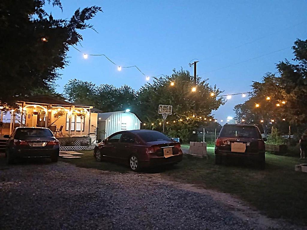 9153 Bouncer Road Quinlan, TX 75474 - Photo 26 of 27 a view of a car parked in back of a house