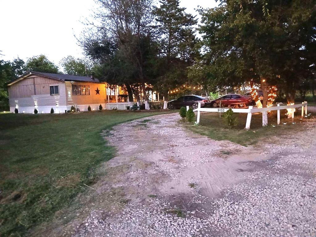 9153 Bouncer Road Quinlan, TX 75474 - Photo 27 of 27 a view of a park with swings and slides