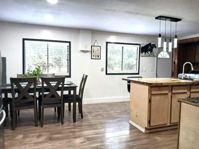 a view of a dining room with furniture window and wooden floor