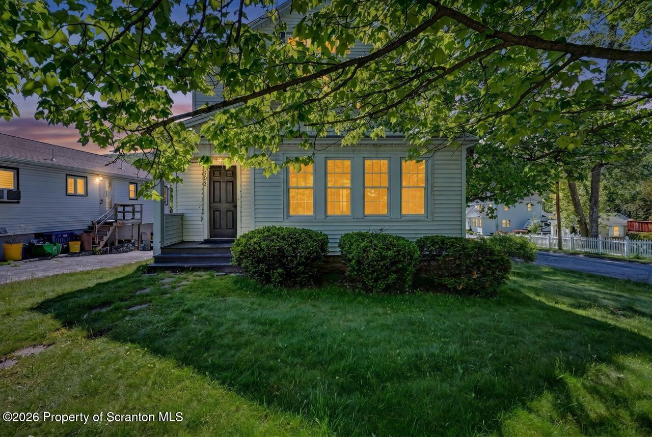 502 Layton Road Clarks Summit, PA 18411 - Photo 8 of 42 a front view of a house with garden