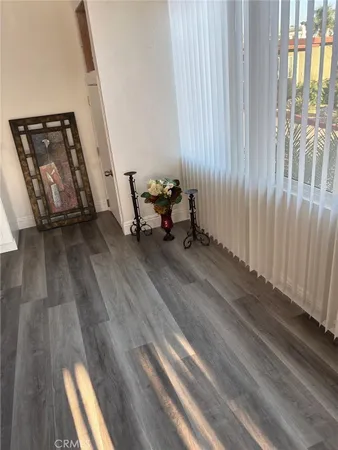 a view of a room with wooden floor and chair