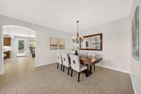 a living room with furniture and a kitchen