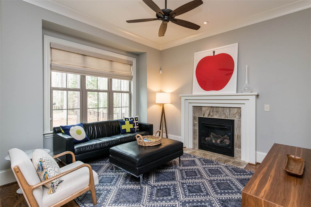 12221 Upper Creek Way Raleigh, NC 27614 - Photo 9 of 30 Cozy den off kitchen and breakfast nook with fireplace. Den