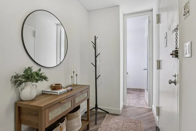 a view of a livingroom with furniture and a chandelier