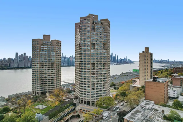 a living room with furniture a flat screen tv and a large window