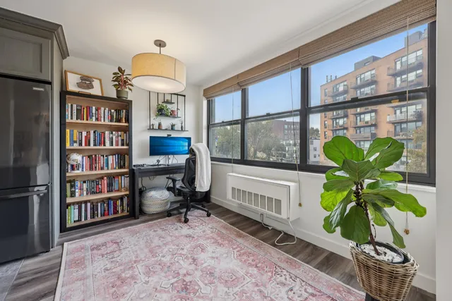 a vase of flowers sitting on a table in a room