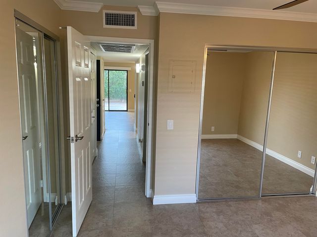 a view of a swimming pool with a patio and a garden