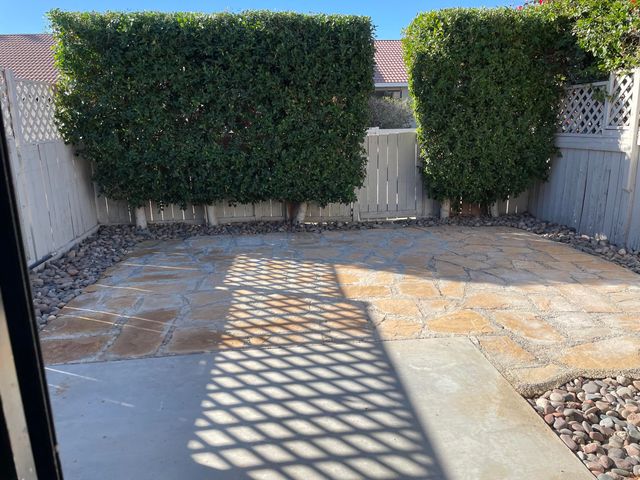 a view of a swimming pool with chairs