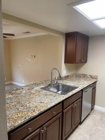 a view living room with granite countertop wooden floor