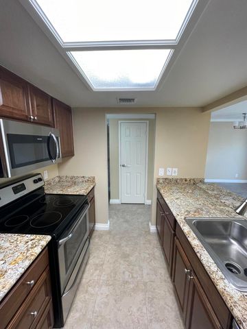 a kitchen with a stove and a microwave