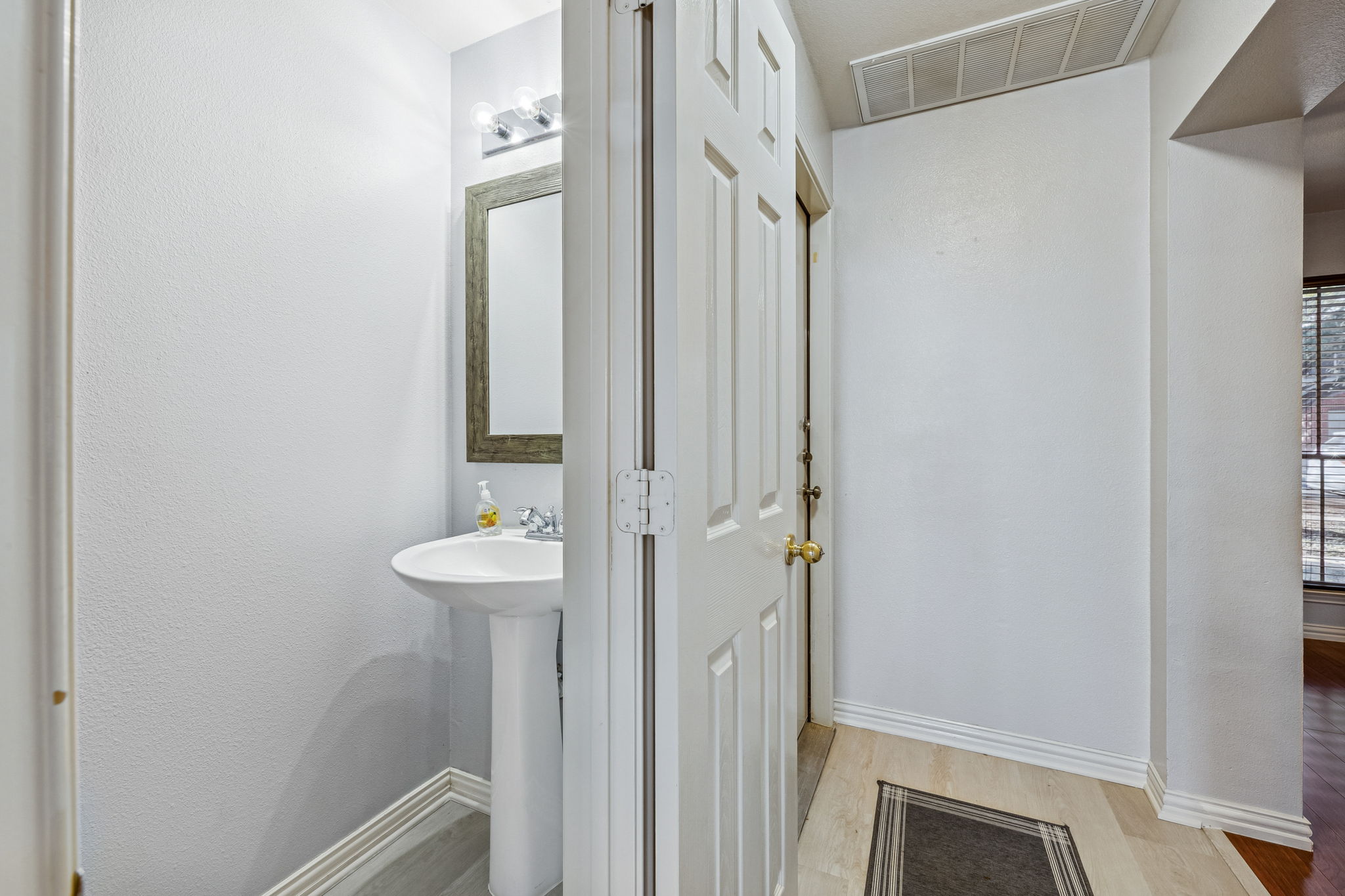 1608 Melibee Trail Austin, TX 78748 - Photo 13 of 29 a bathroom with a sink a mirror and a shower