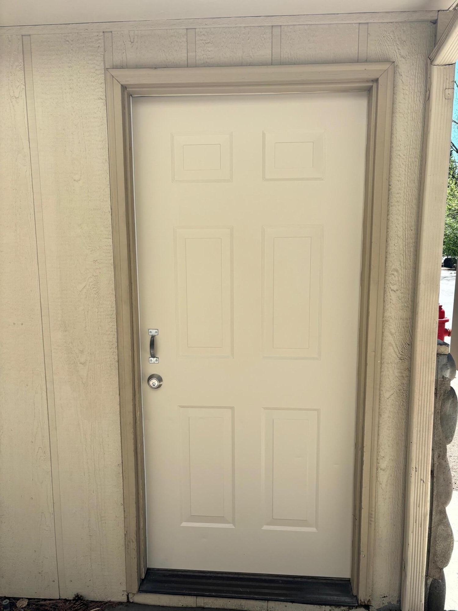 1050 Northeast Butler Market Road, Unit 24 Bend, OR 97701 - Photo 30 of 30 Freshly painted man door to garage