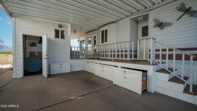 a front view of a building with outdoor seating