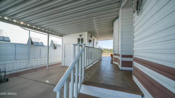 a dining room with furniture and chandelier