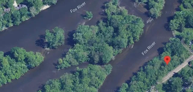 an aerial view of house with yard