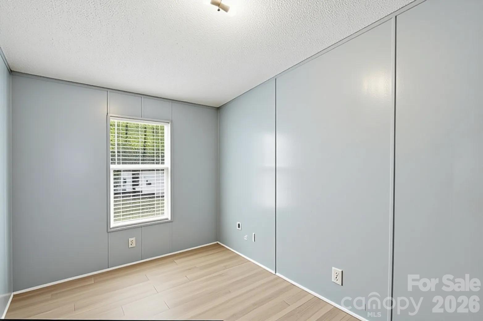 605 Ridgewood Court Mount Holly, NC 28120 - Photo 10 of 32 a view of an empty room with a window