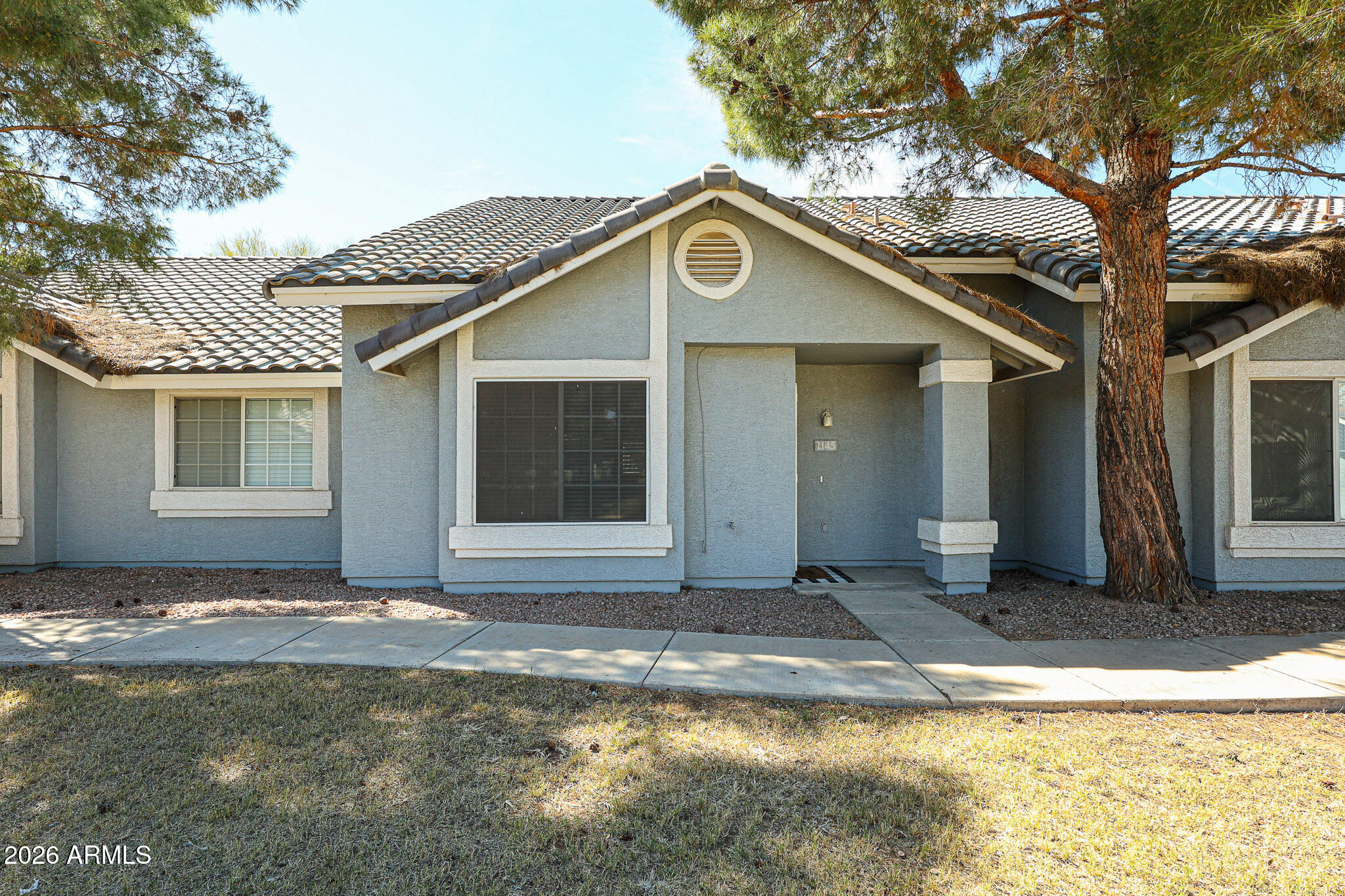 860 North McQueen Road, Unit 1145 Chandler, AZ 85225 - Photo 1 of 63 a front view of a house with a yard
