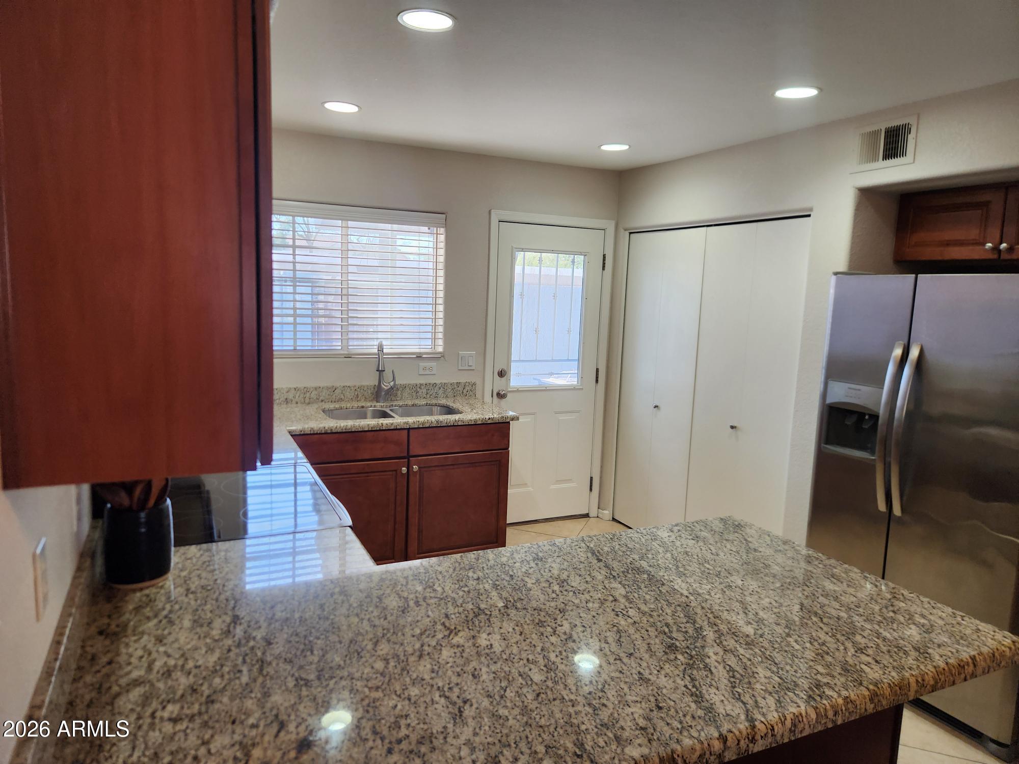 860 North McQueen Road, Unit 1145 Chandler, AZ 85225 - Photo 11 of 63 a spacious bathroom with a granite countertop sink and a bathtub
