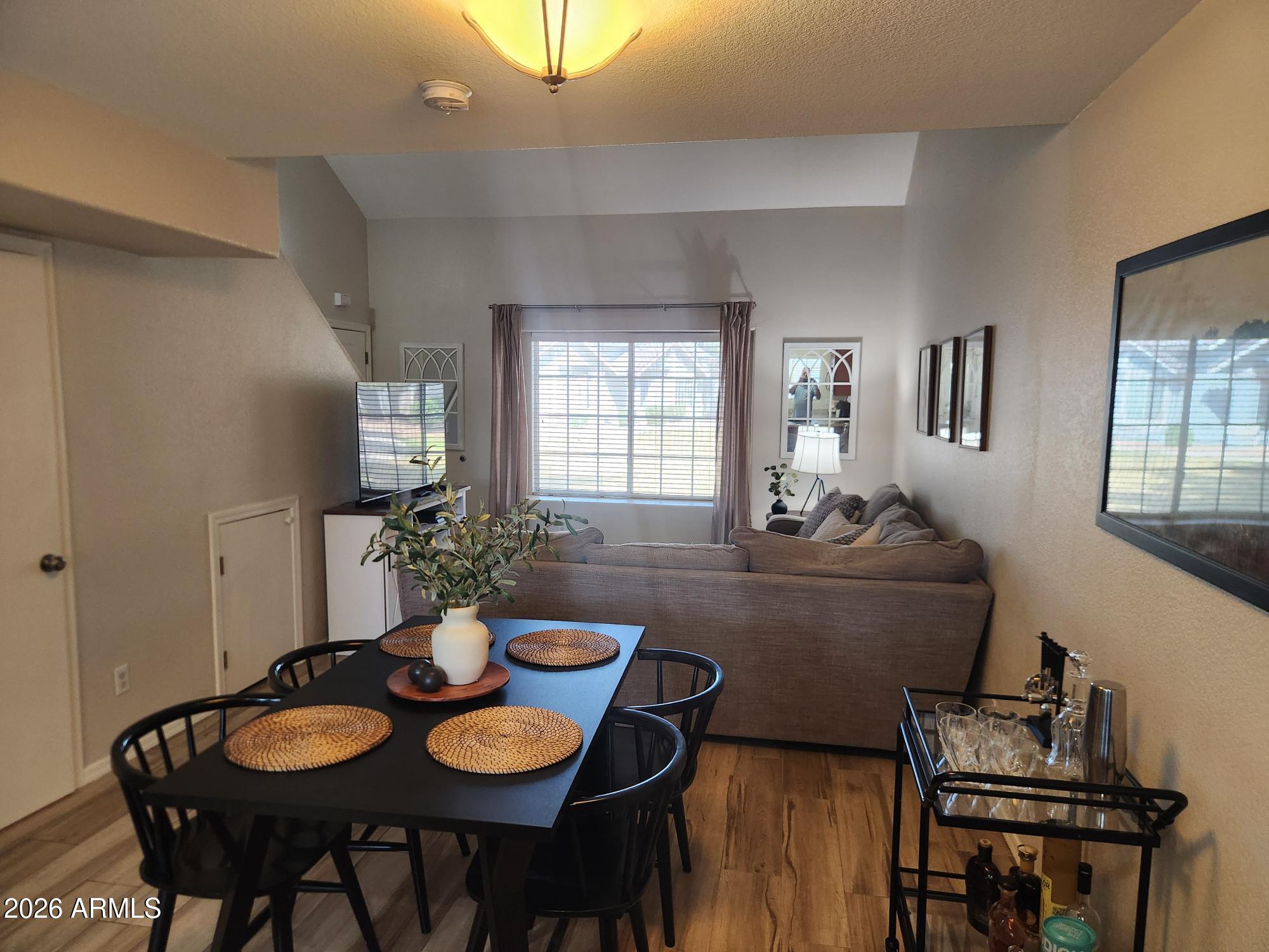 860 North McQueen Road, Unit 1145 Chandler, AZ 85225 - Photo 16 of 63 a view of a dining room with furniture and window