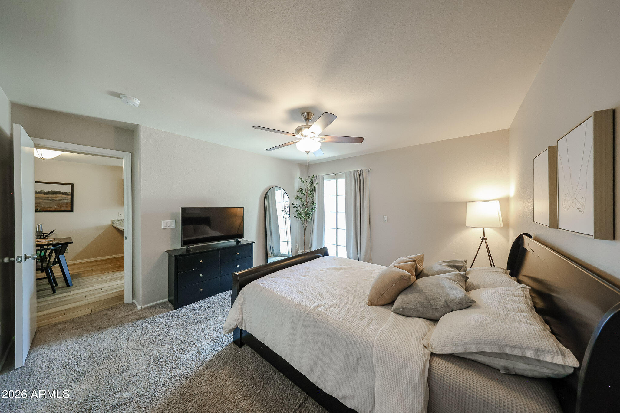 860 North McQueen Road, Unit 1145 Chandler, AZ 85225 - Photo 20 of 63 a bedroom with a bed and a flat screen tv