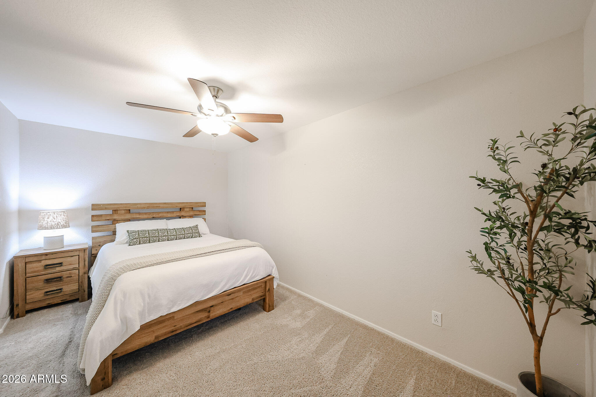 860 North McQueen Road, Unit 1145 Chandler, AZ 85225 - Photo 37 of 63 a bedroom with a bed and a chandelier