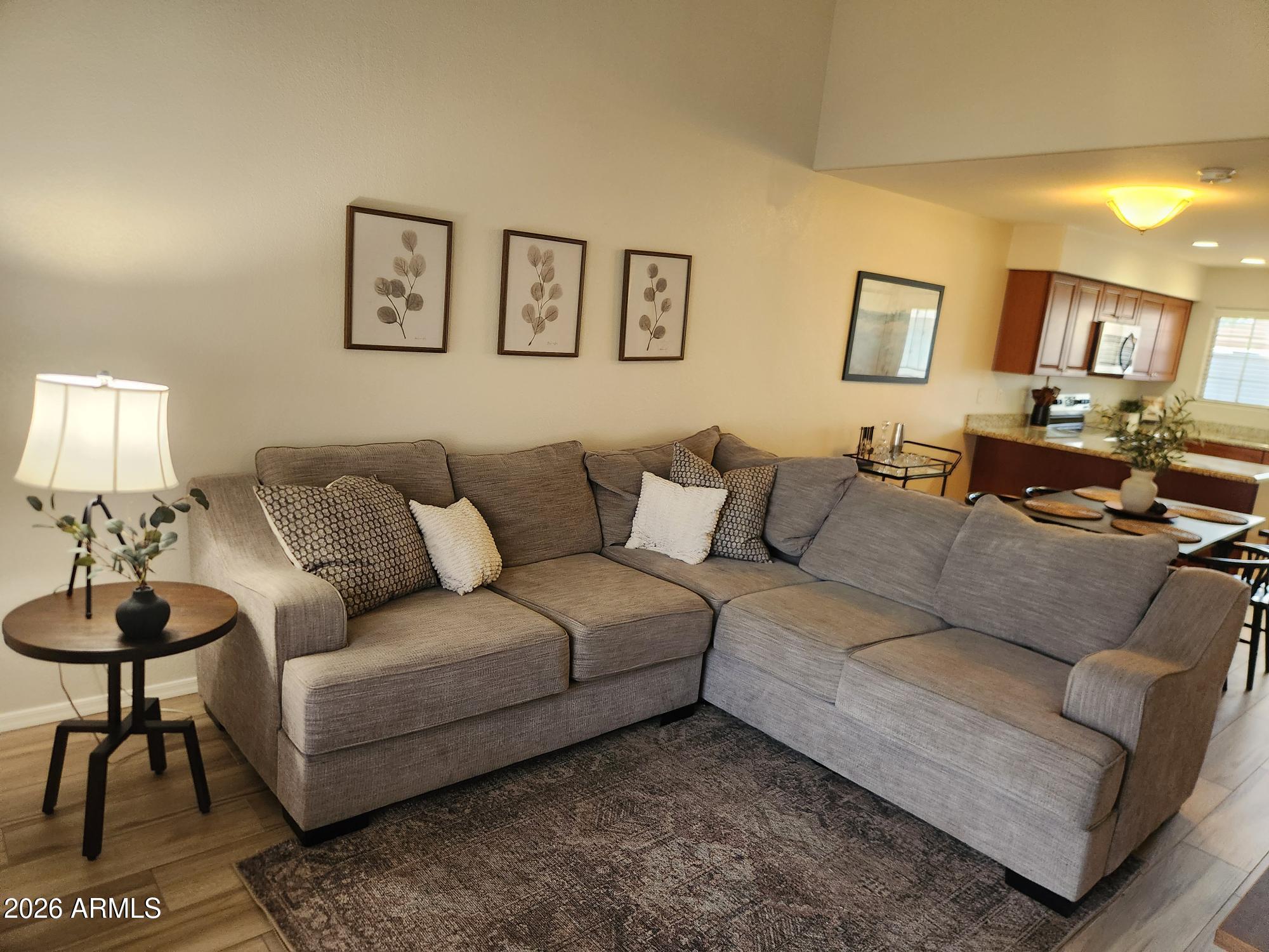 860 North McQueen Road, Unit 1145 Chandler, AZ 85225 - Photo 4 of 63 a living room with furniture and a lamp
