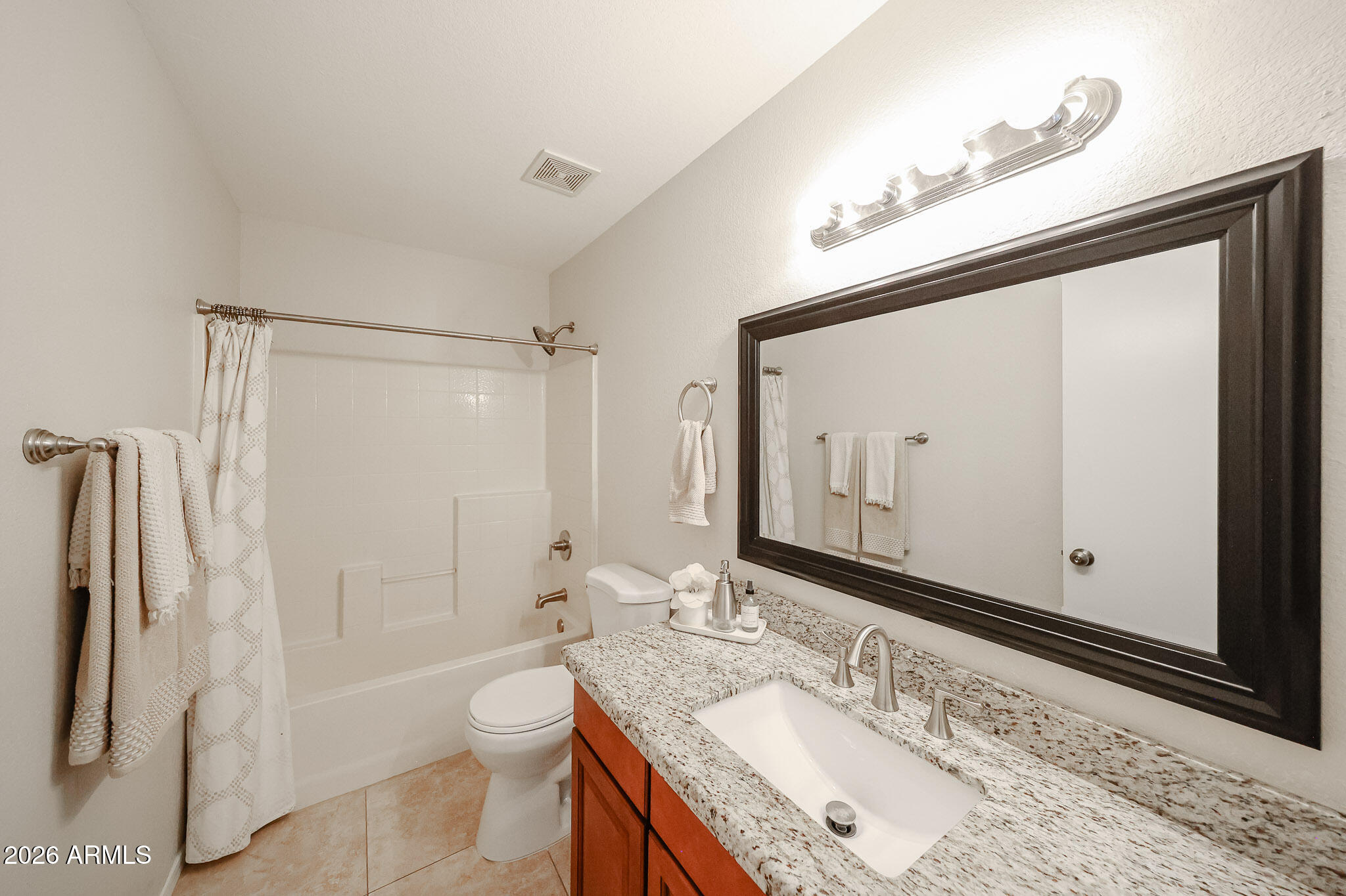 860 North McQueen Road, Unit 1145 Chandler, AZ 85225 - Photo 42 of 63 a bathroom with a granite countertop sink toilet and shower