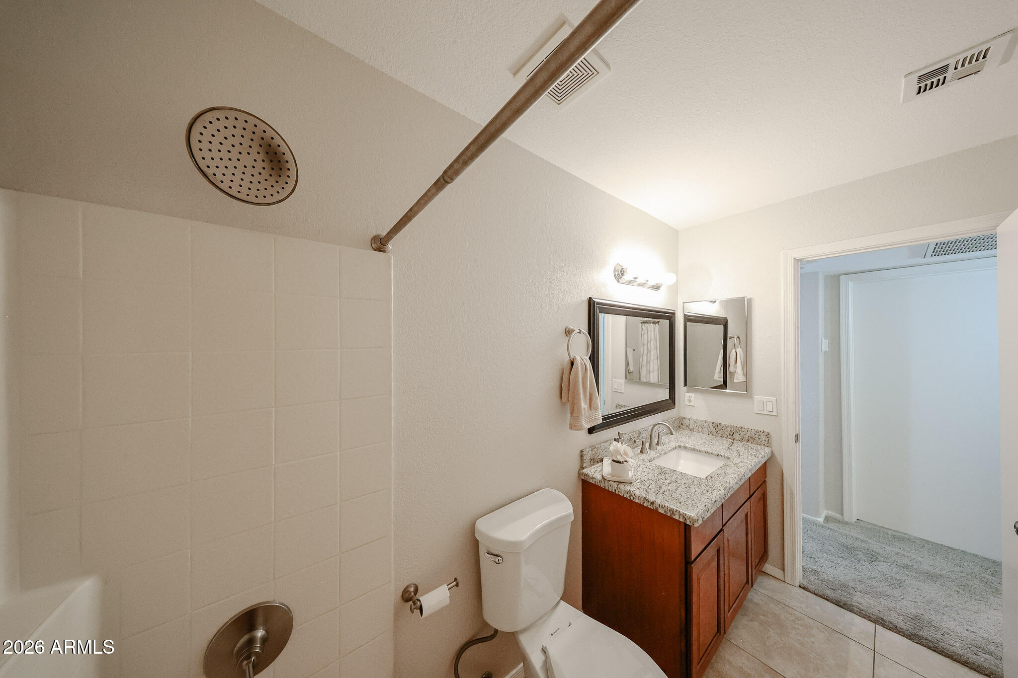 860 North McQueen Road, Unit 1145 Chandler, AZ 85225 - Photo 43 of 63 a bathroom with a toilet a sink and mirror