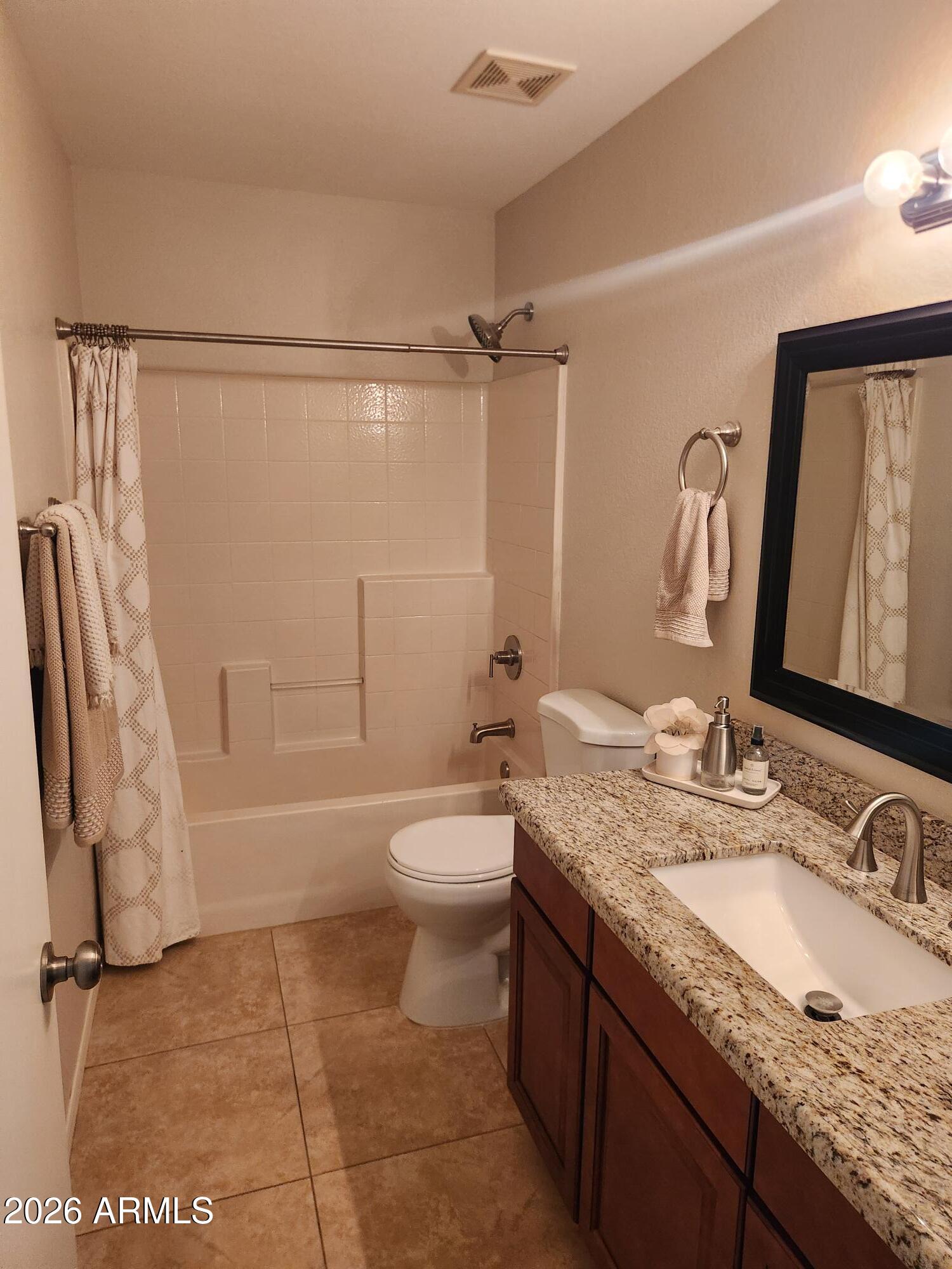 860 North McQueen Road, Unit 1145 Chandler, AZ 85225 - Photo 45 of 63 a bathroom with a granite countertop sink toilet and shower